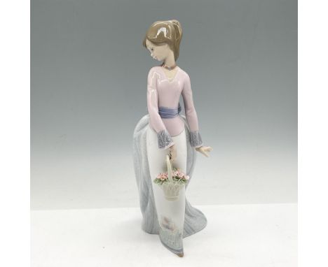 Glossy figure in elegant attire, holding a basket of delicate pink flowers. 1994 Collectors Society. Lladro backstamp. This i