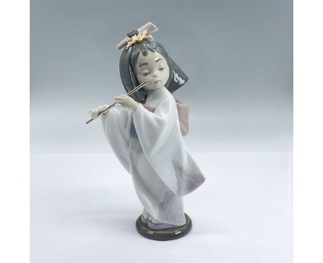 Glossy porcelain figure of a girl in a white kimono playing a flute. Lladro backstamp. Includes original box: 5.5"L x 8"W x 5