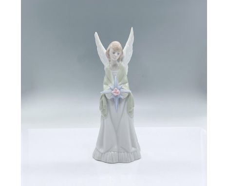 A glossy figure of an Christmas angel wearing a sage green shawl, holding a large blue star adorned with a pink flower in the