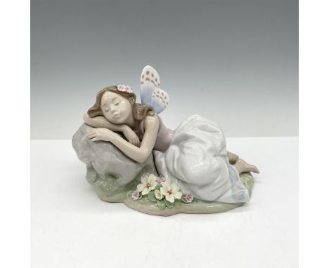 Glossy figure part of the Privilege series is resting her head for a nap. Colored in pinks, gray and white. Lladro backstamp.