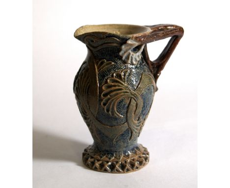 R. W. Martin (Martin Brothers), Fulham, a high-relief decorated jug with raised and incised detail. Inscribed to the base, da