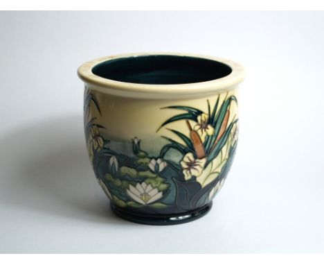Moorcroft, a relief tube-line decorated planter, impressed and painted marks to the base. Height approximately 165mm, diamete