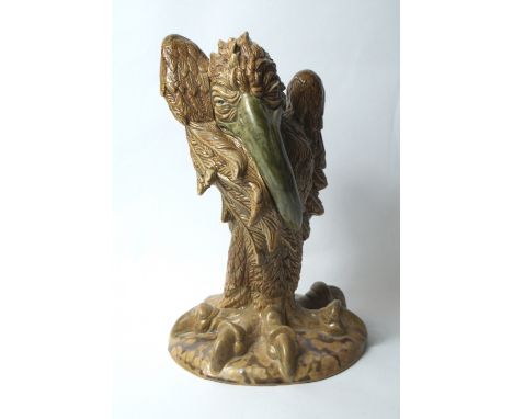 Andrew Hull for Cobridge, a Martin Brothers-style glazed ceramic and hand painted vulture trial lidded bottle, with impressed