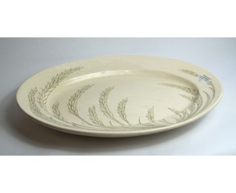 Early Moorcroft ceramic oval platter, simple tube line decoration in green over a white ground. Signed to the base. Width app