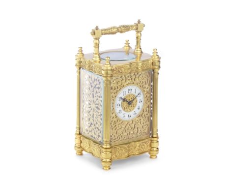 A gilt brass carriage clockin the French 19th century French stylethe fancy Anglais case with foliate cast serpentine friezes