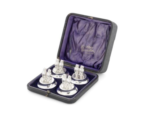 A cased set of four Edwardian novelty silver owl card / menu holdersLevi &amp; Salaman, Birmingham 1906 Each modelled with a 