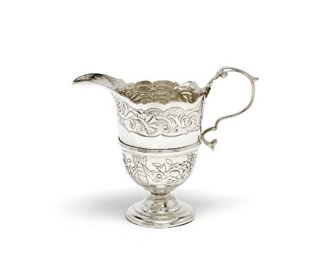 An 18th century Irish silver cream jugno maker's mark, only crowned harp and Hibernia, circa 1750With wavy rim, applied girdl