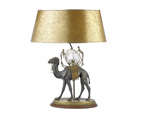 An early 20th century patinated and gilt spelter and brass novelty camel spirit dispenser, later adapted as a table lampthe b