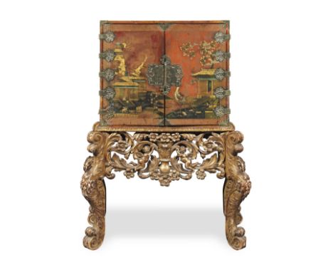A William and Mary japanned and engraved-brass mounted cabinet on a carved giltwood stand1690-1700, the cabinet decorated wit