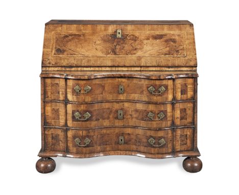 A German second quarter 18th century walnut and fruitwood line-inlaid serpentine bureauThe top and fall each inlaid with a ce