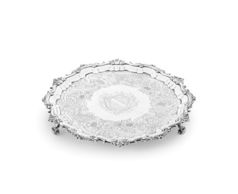 An 18th century Irish silver salvermaker's mark IW with pellet between, Dublin, circa 1750 Shaped-circular, scroll border emb