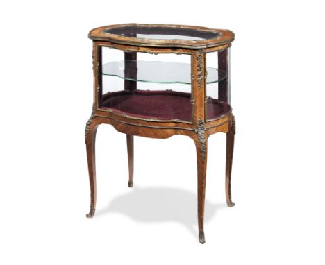 A French late 19th/early 20th century ormolu mounted bois satine bijouterie tablein the Louis XV styleOf shaped outline, with