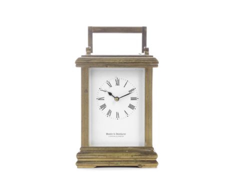 An early 20th century French gilt brass carriage clockthe dial with retailers mark, Boodle and Dunhurst, Livrepool &amp; Ches