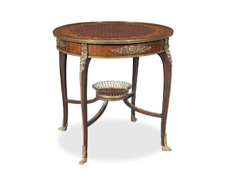 A French late 19th/early 20th century ormolu mounted kingwood, bois satine, mahogany, marquetry and parquetry gueridon attrib