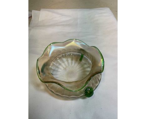 An Art Nouveau slightly iridescent glass bowl with shaped green tinted rim and three green glass applied motifs, unmarked, di