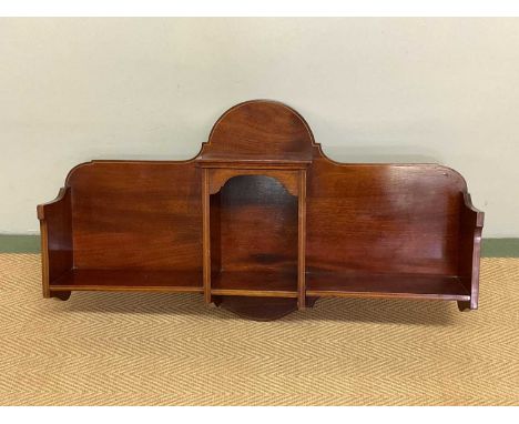 A mahogany and line inlaid wall shelf with central recess, width 78cm.