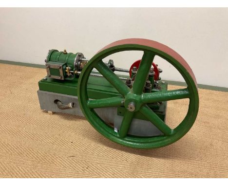 A large scratch-built static engine with six spoked side wheel beside the main rectangular platform, length 60cm.