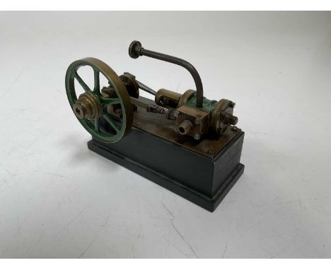 A scratch-built static engine on wooden plaque inscribed 'Steven's Model Dockyard...', length 14cm.