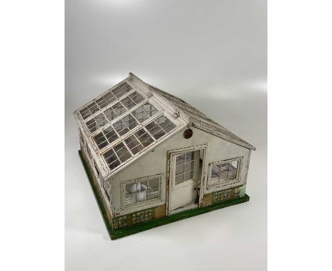 ATTRIBUTED TO LINES; an unusual Art Deco period greenhouse with original staging and many porcelain and china plants, 57 x 50