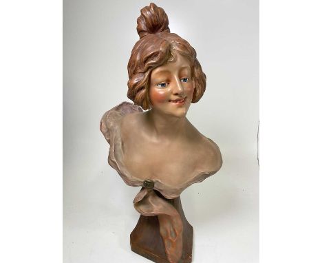 An early 20th Century Art Nouveau pottery bust of a young woman, signed C R Faggioni, height 76cm