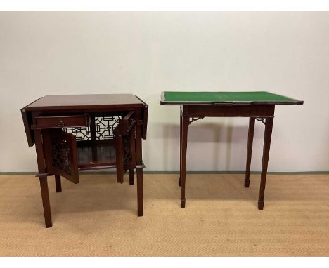 A folding card table on four supports, height 72cm, width 80cm, with a drop-leaf cabinet with Oriental style pierced panels.