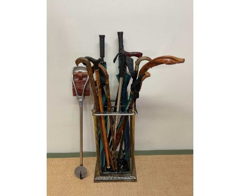 A contemporary stick stand with a collection of sticks.