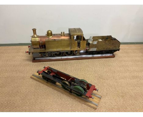 A large scratch-built copper and brass engine tender and spare frame, presented with a small section of track, length of engi