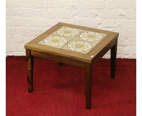 A rosewood tile top coffee table.