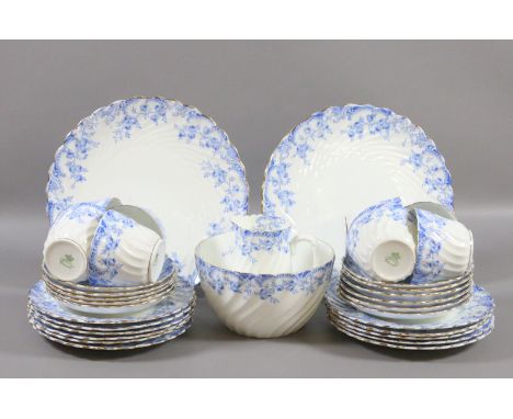An Edwardian Aynsley tea service painted with lambrequin borders in blue (thirty four pieces).
