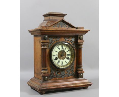 A nineteenth century German walnut cased bracket clock. With Art Nouveau pewter fretwork mounts and having an eight day movem