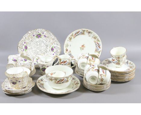 A Jackson & Gosling china tea service decorated with flower, leaves and pheasants along with a similar tea service.