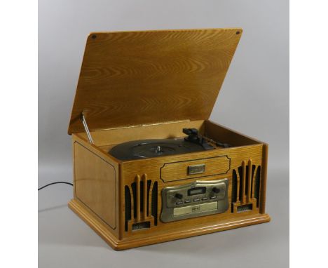 A vintage style wooden veneered record, C,D and radio hifi system.