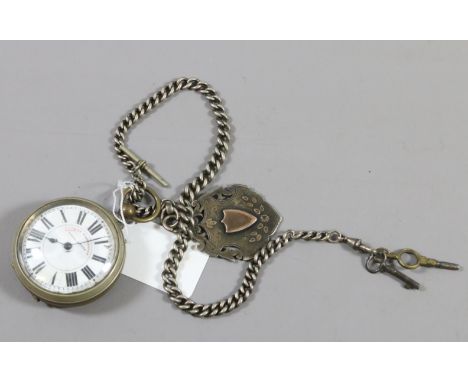 A railway timekeeper pocket watch with enamel face along with silver Albert chain and fob.