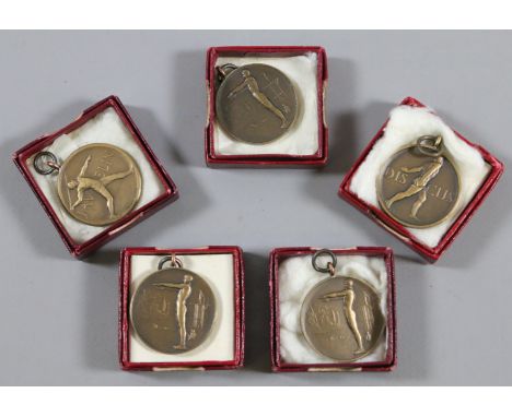 Five 1950s bronze athletes medals from the King Edward VII School, Sheffield.
