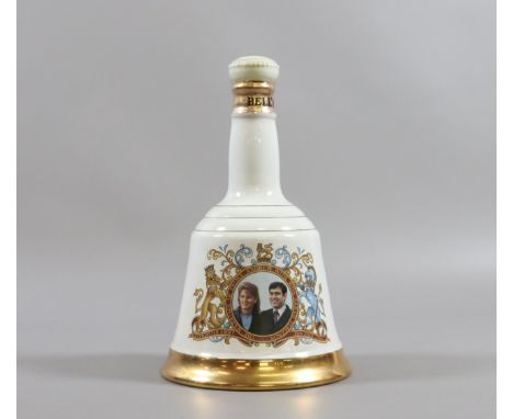 A Wade commemorative Bells Whiskey decanter Prince Andrew & Sarah Ferguson sealed and full.