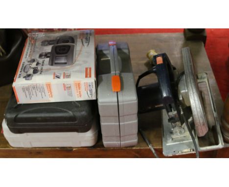 A collection of electric and battery power tools to include drills, circular saw and boxed CCTV set.