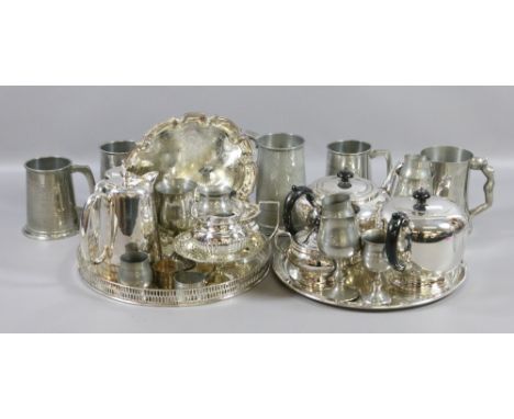 A good collection of silver plate including three part tea service on tray, water jugs, tankards, napkin rings, etc.