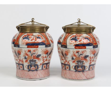 A pair of Samson Japanese Imari baluster jars with bronze mounts and covers. Painted in the Imari style with garden landscape