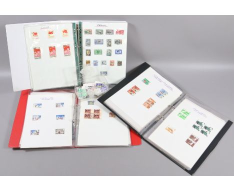 Three assorted stamp albums postage due, various countries, Christmas stamps and a box of loose stamps.