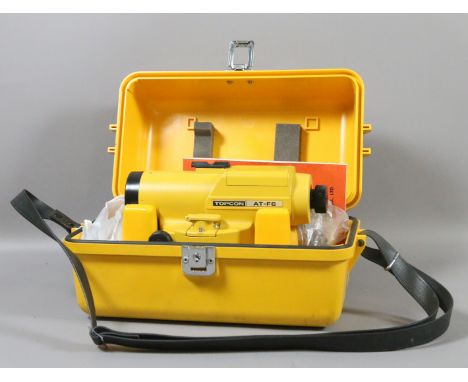 A cased Topcon Auto level and instruction manual.