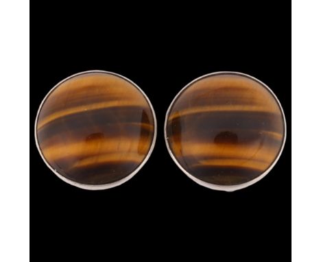 NIELS ERIK FROM - a pair of Danish modernist sterling silver tigers eye clip-on earrings, plain circular form with round cabo