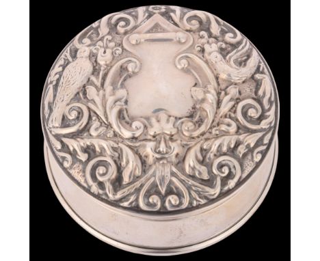 An Elizabeth II silver dressing table jewel box, WI Broadway & Co, Birmingham 1973, circular form with relief embossed foliat