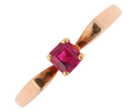 A 9ct gold single stone ruby dress ring, London 1980, claw set with rectangular step-cut ruby, setting height 4mm, size O, 1.