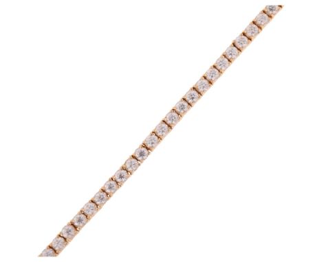 A 14ct gold cubic zirconia tennis line bracelet, 17cm, 12.8g . Condition Report: No damage or repair, all stones present, fit