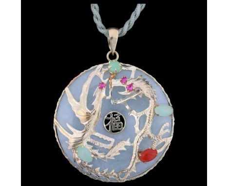 A 14ct gold gem set jade bi disc pendant necklace, with applied dragon and phoenix decoration, 31.7mm, cord 62cm, 10.2g . Con