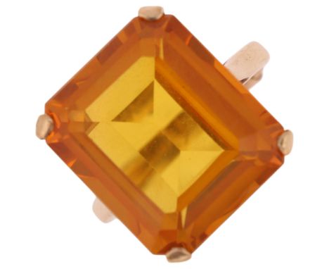 A 9ct gold single stone yellow synthetic sapphire dress ring, London 1969, claw set with octagonal step-cut synthetic sapphir