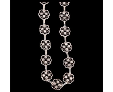A Scandinavian sterling silver flowerhead line necklace, no maker, unmarked mount tests as silver, 42cm, 50.4g . Condition Re