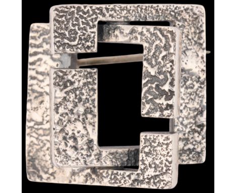 UWE HELMUTH MOLTKE - a Danish brutalist sterling silver abstract brooch, interlocking square form with textured decoration, 2