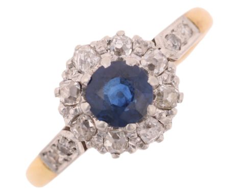 An 18ct gold sapphire and diamond cluster ring, platinum-topped claw set with round-cut sapphire and old-cut diamonds, settin