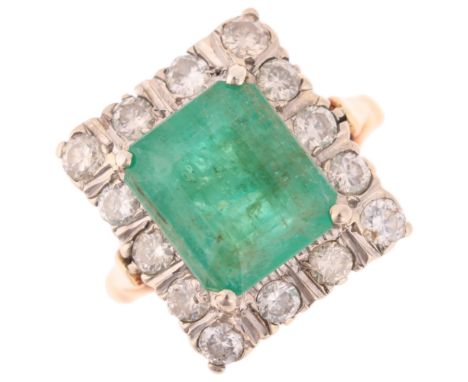 An 18ct gold emerald and diamond cluster ring, claw set with 4ct octagonal step-cut emerald surrounded by modern round brilli